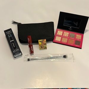 Ipsy bag with eyeshadow and blending brush with lipstick and mascara.